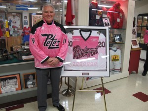 Wayne Boddy poses with the 2010 Pink in the Rink sweater
